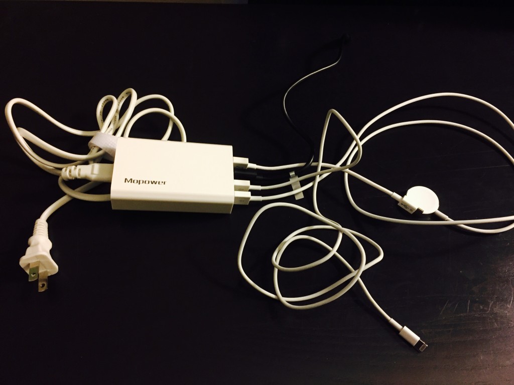 Mopower four port travel charger with two USB chargers, an Apple Watch charger, and an Apple Lightning cord