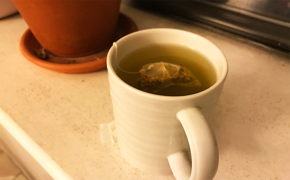 A cup of Rishi tumeric ginger tea.